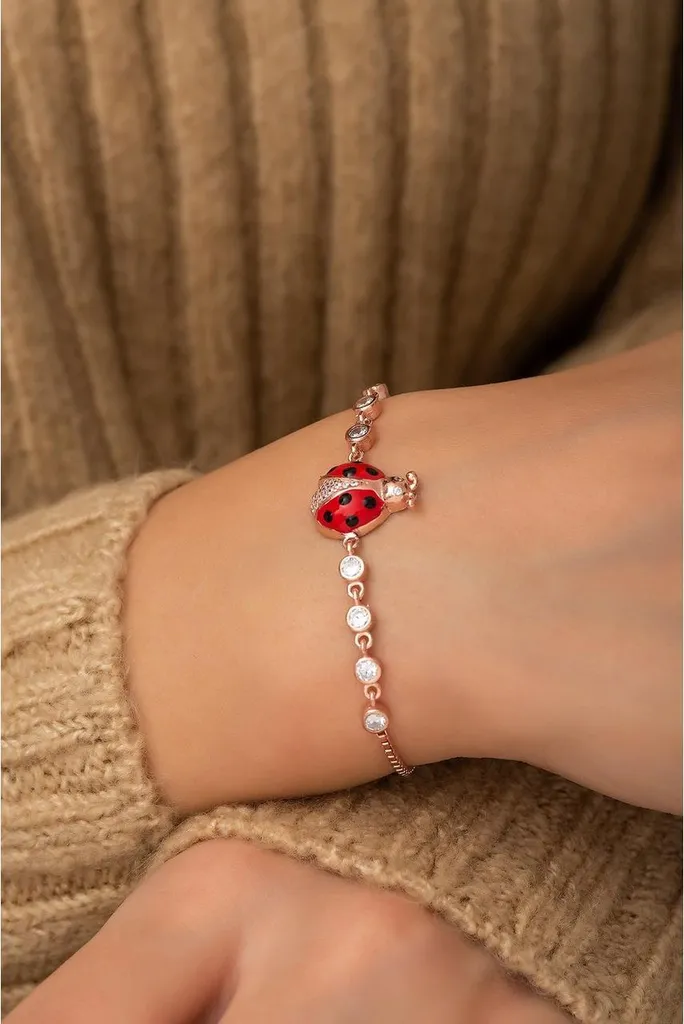 Gourmette femme en argent rhodié, charm coccinelle et oxydes de zirconium