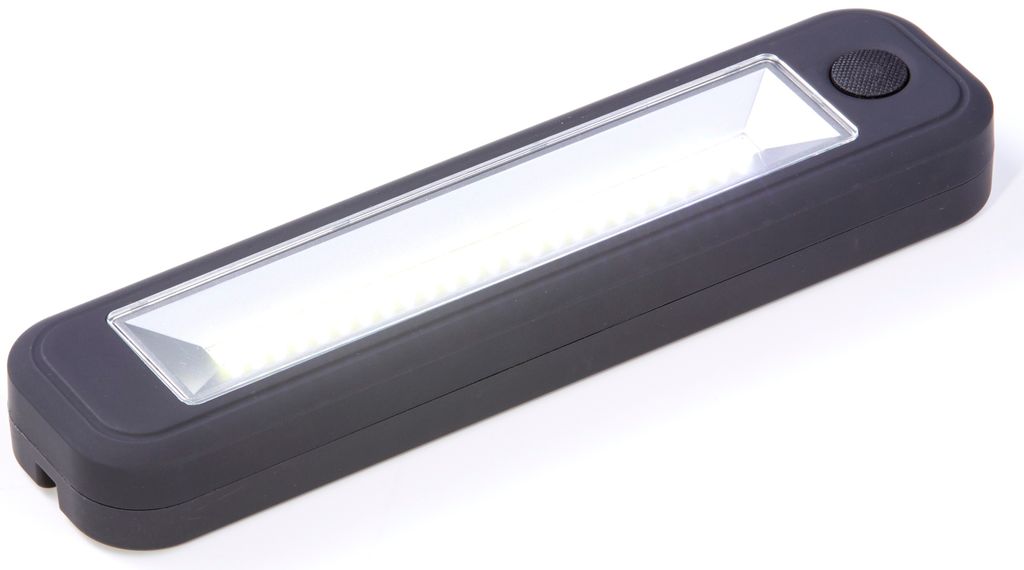 A dark gray LED work light with a clear lens is shown on a white background.
