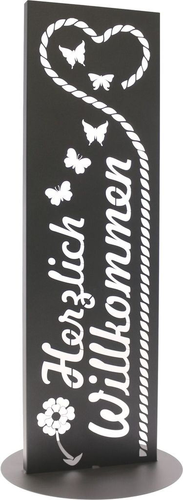 A black garden sign with white lettering and decorative elements.