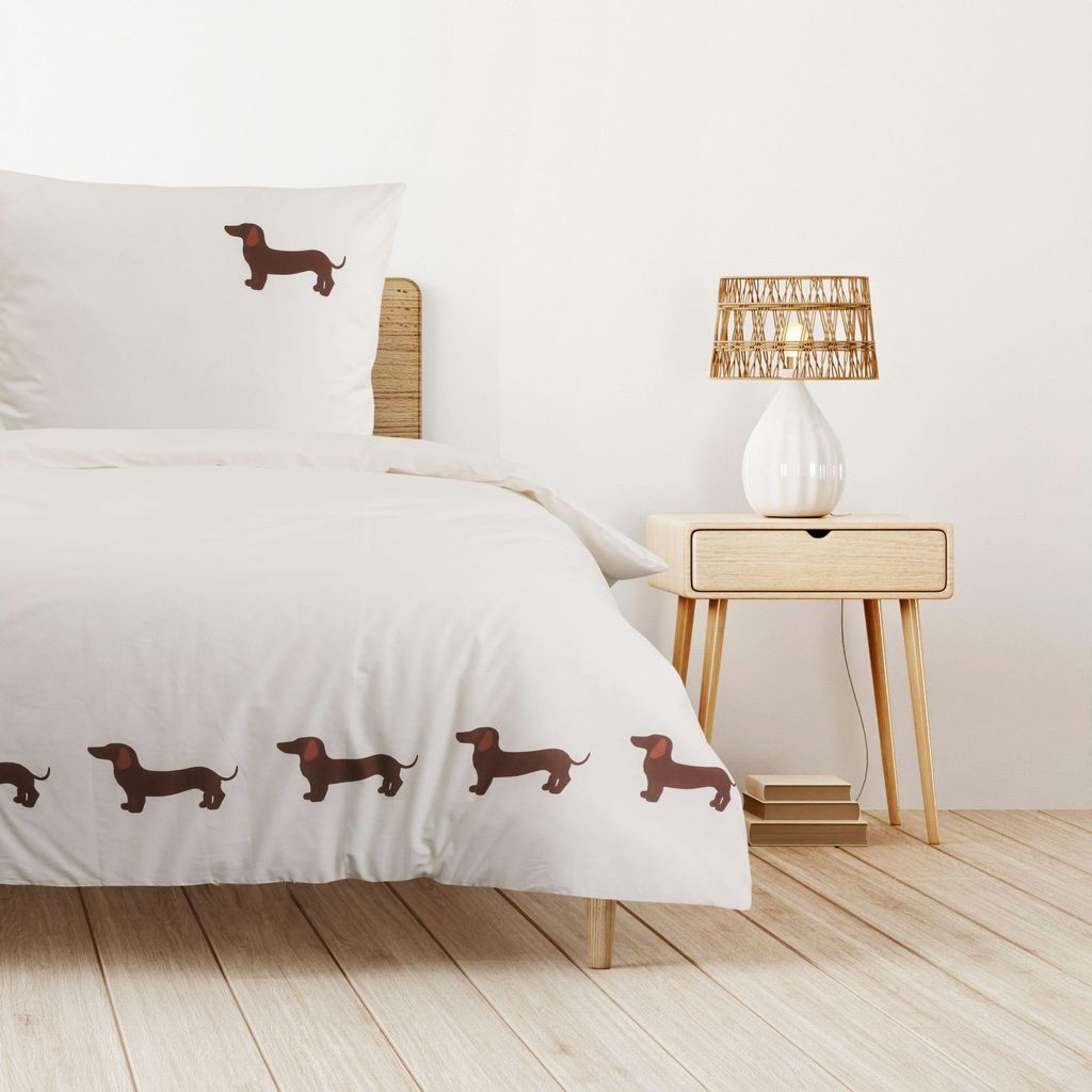 A bedroom scene with a bed and a nightstand.