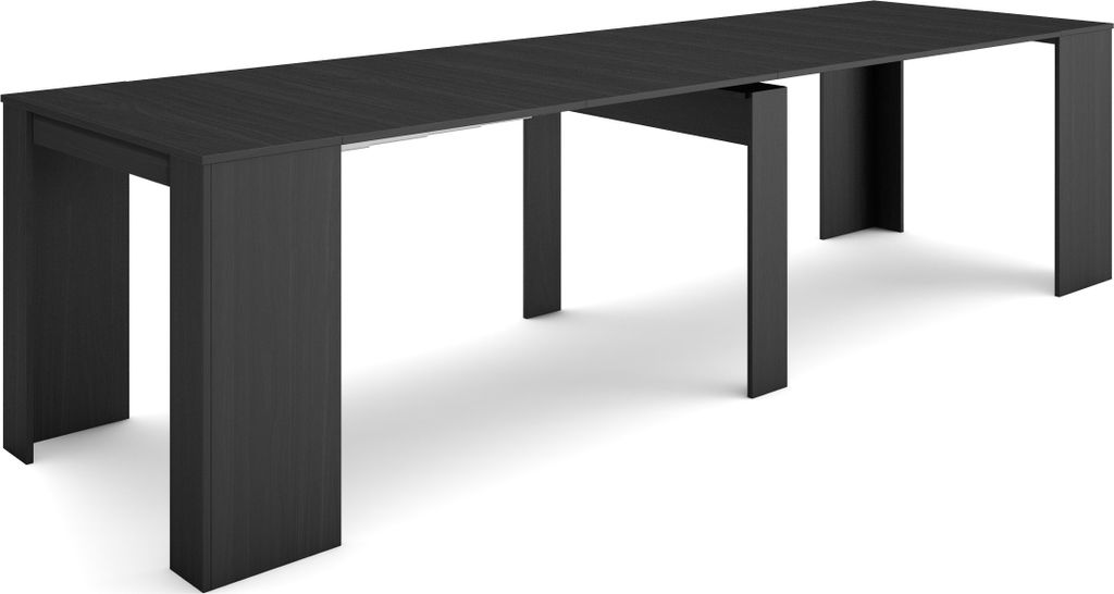 A long, dark, modern dining table with two sets of legs.
