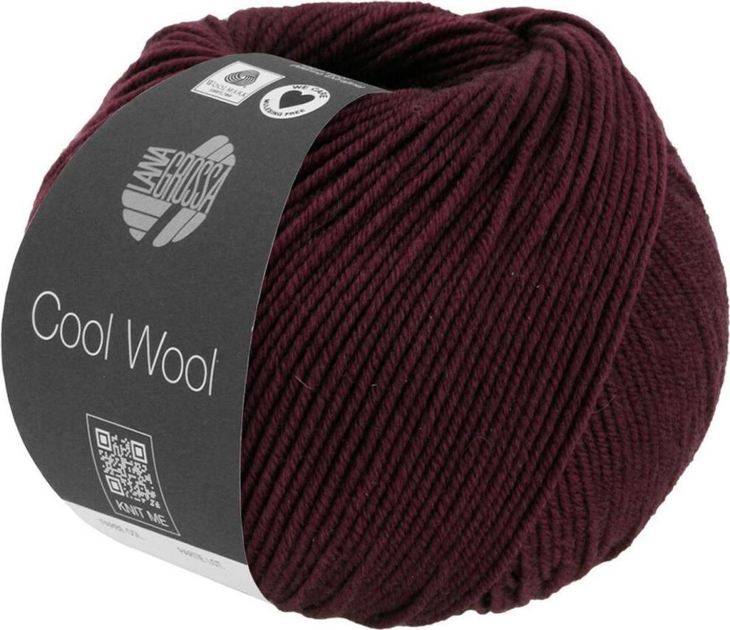 A ball of burgundy yarn with a dark gray label.