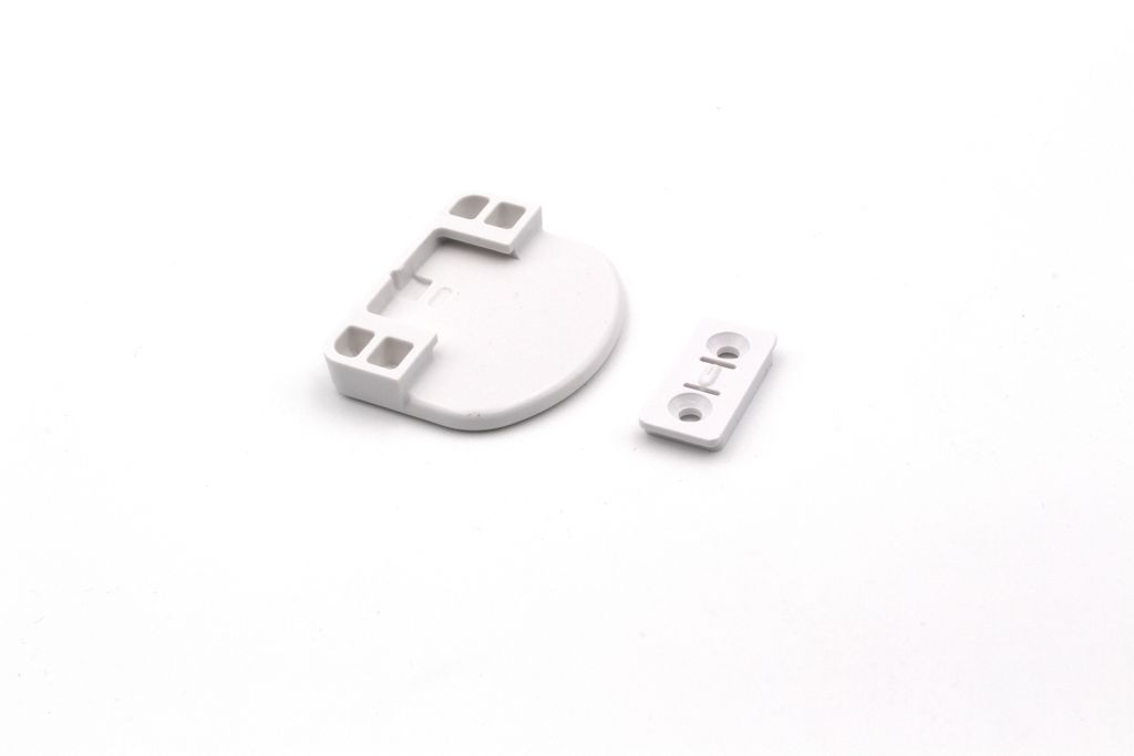Two white plastic hardware components are shown on a white background.
