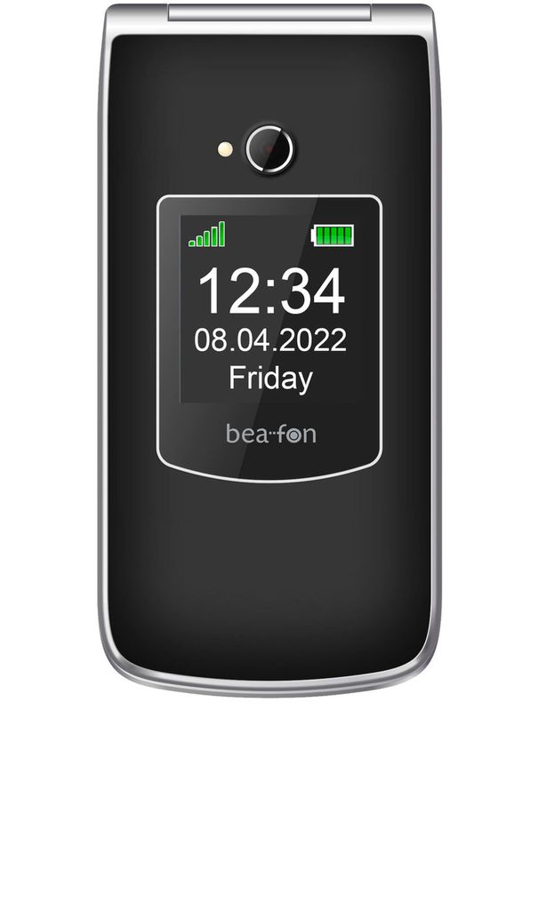 A close-up shot of a black and silver flip phone displaying the time, date, and day of the week on its screen.