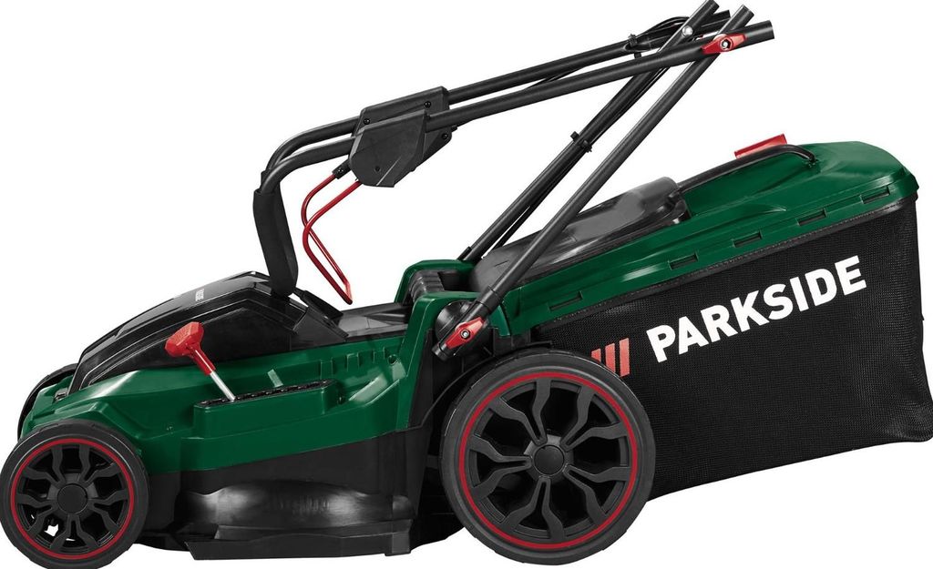 A side view of a green and black Parkside lawnmower with a black grass catcher bag.