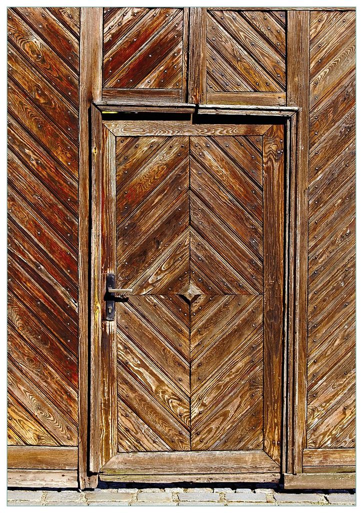 Wallario Premium Glasbild, freischwebende Optik, kräftige Farben, Größe 100 x 70 cm Motiv Alte Holztür mit diagonalem Muster