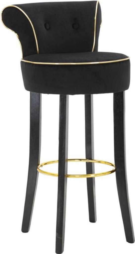 A black bar stool with gold trim and a gold footrest.