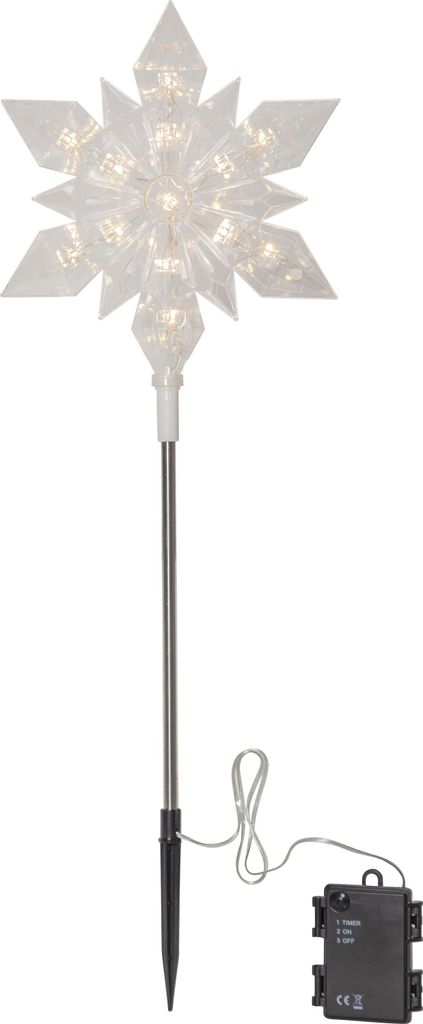 A snowflake-shaped garden light with a stake and battery pack.