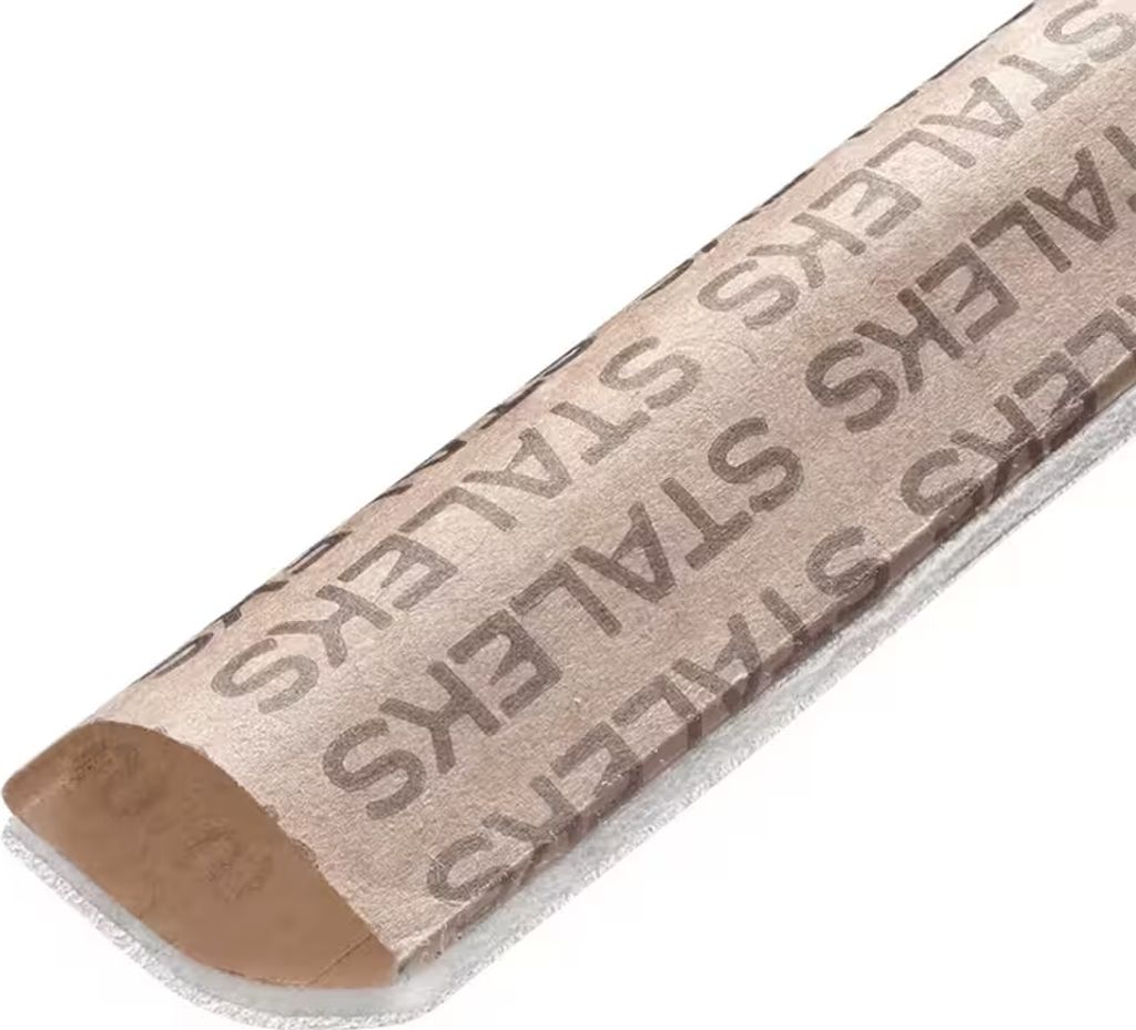 A close-up, angled shot of a single disposable nail file with the brand name printed repeatedly on its surface.