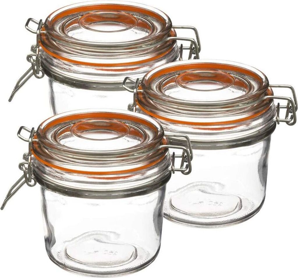 Three glass jars with orange silicone seals and wire bail closures are arranged diagonally on a white background.
