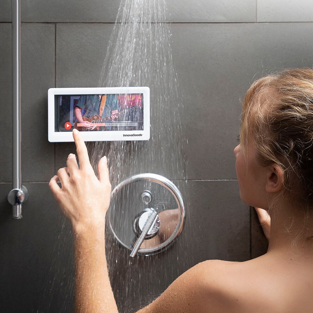 A woman is using a waterproof phone case in the shower.