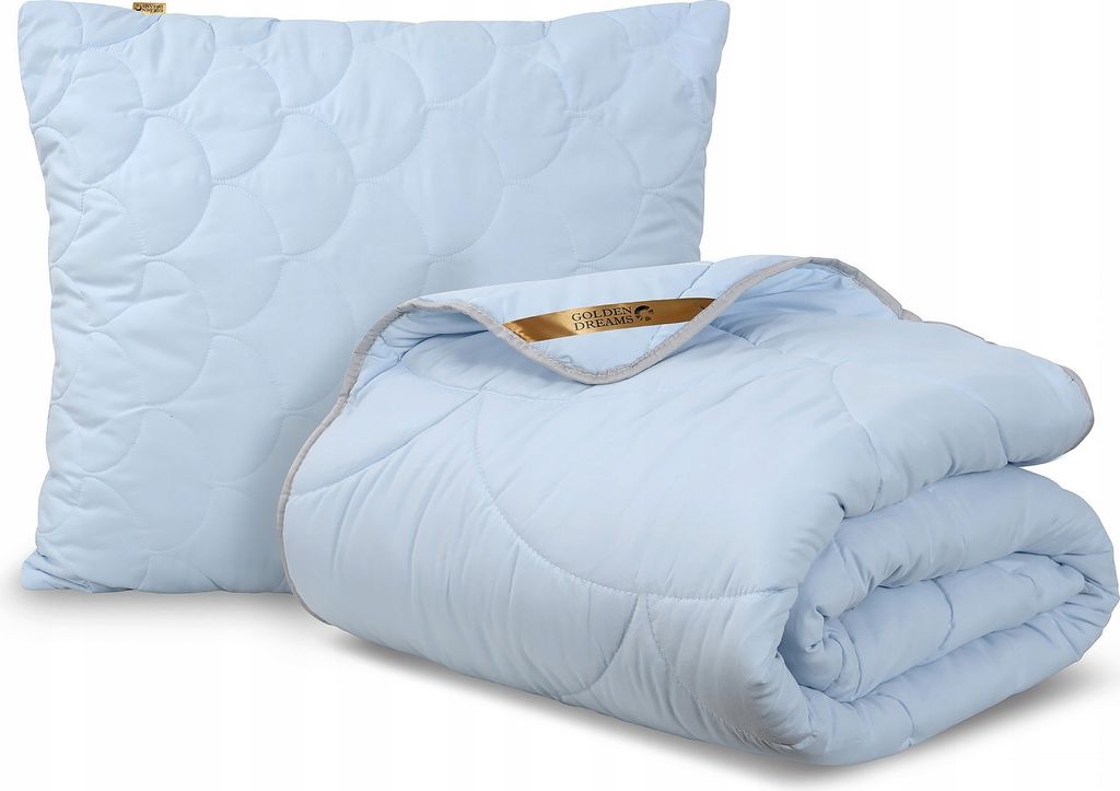 A light blue pillow and a folded comforter are displayed against a white background.