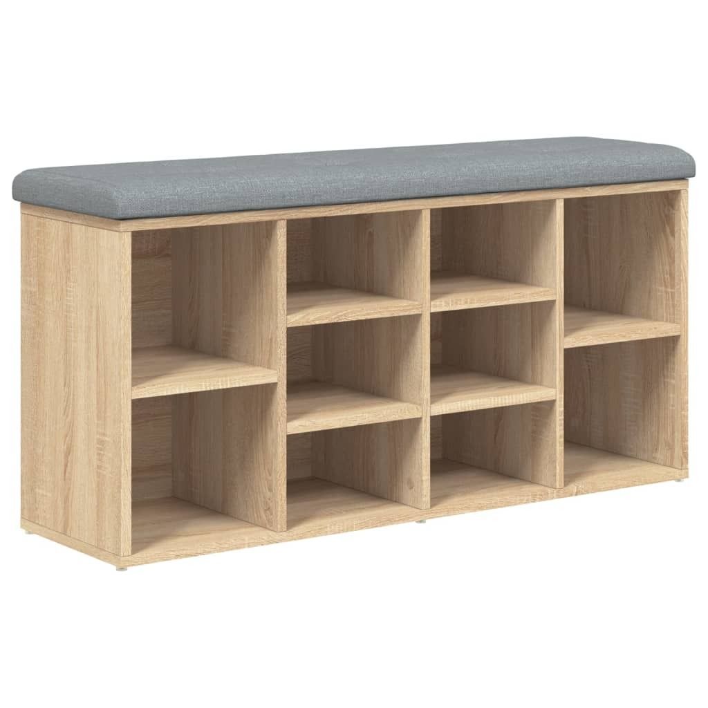 A shoe bench with multiple storage compartments and a padded seat.