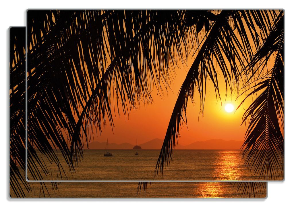 Wallario Frühstücksbrettchen 2er Set aus Glas, je 20 x 30 cm, mit rutschfesten Füßen, Motiv Sonnenuntergang unter Palmenblättern