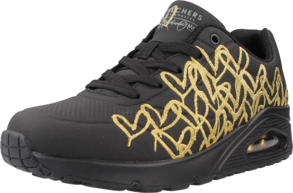 A single black SKECHERS UNO sneaker with gold heart detailing is shown from a side angle against a white background.