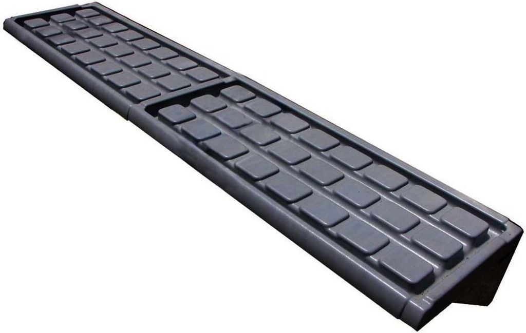 A gray shelf insert with a grid of rectangular indentations, shown at an angle against a white background.