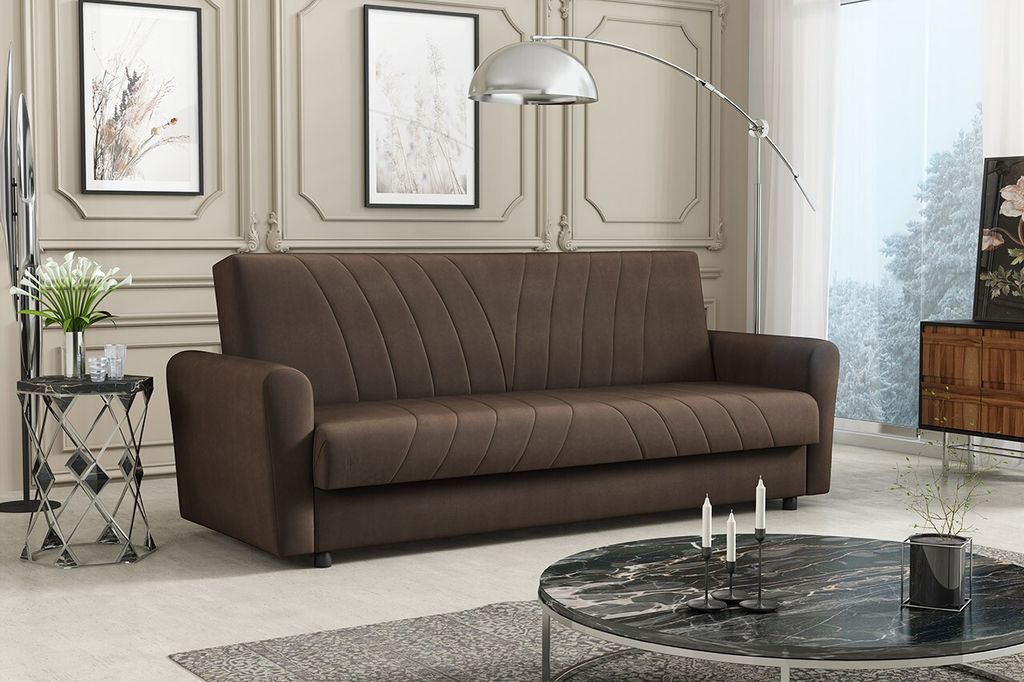 A brown sofa in a living room setting with decorative elements.