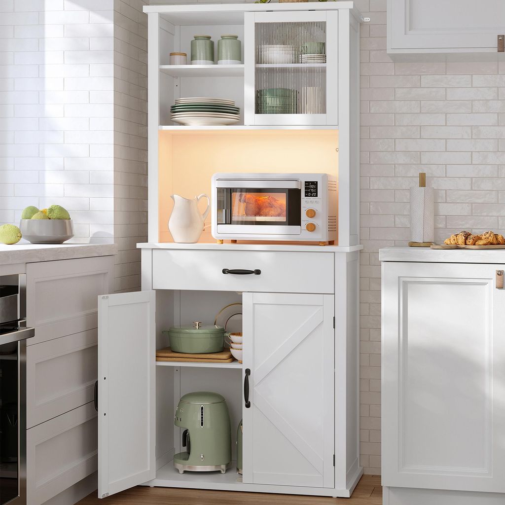 A white kitchen hutch with various kitchen items on display.