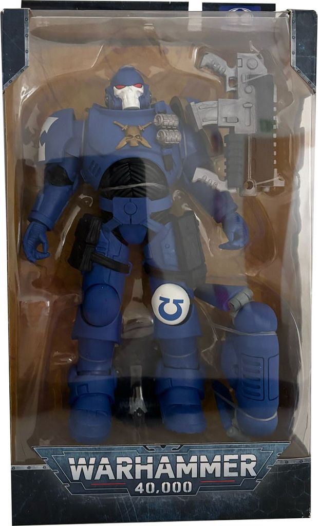 A Warhammer 40,000 action figure in its packaging.