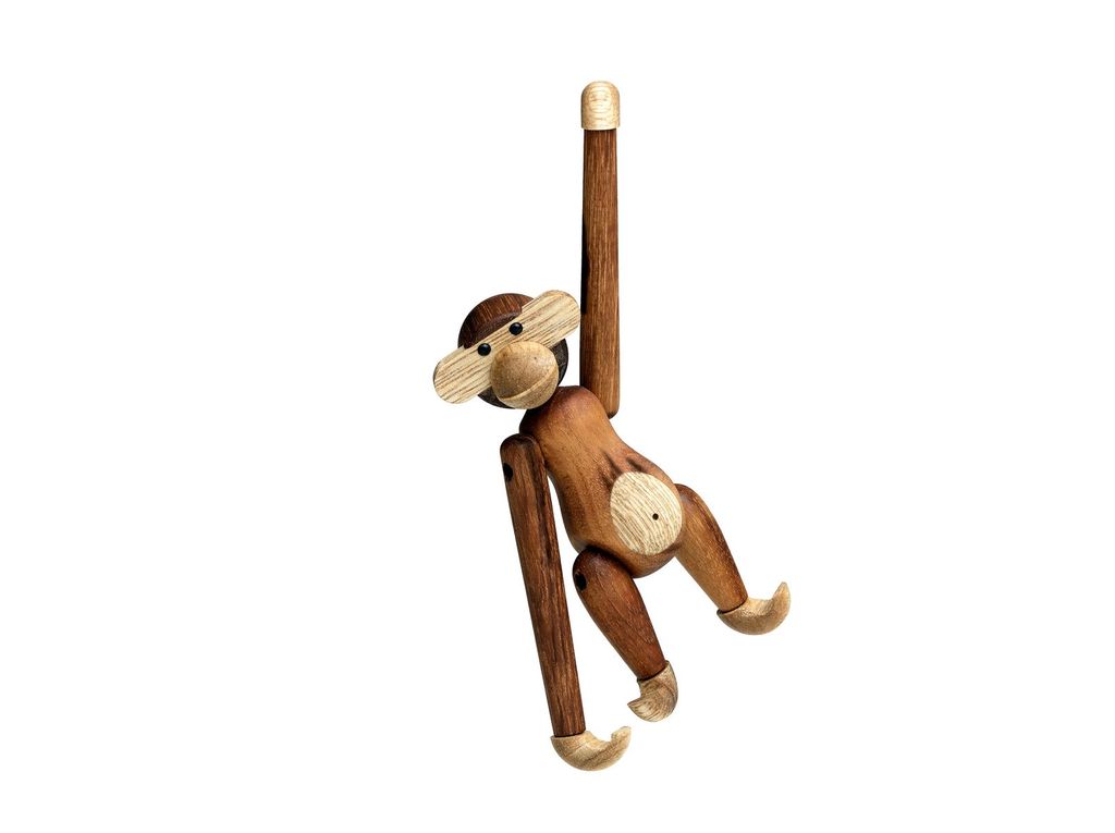 A wooden monkey toy hanging from an invisible support.