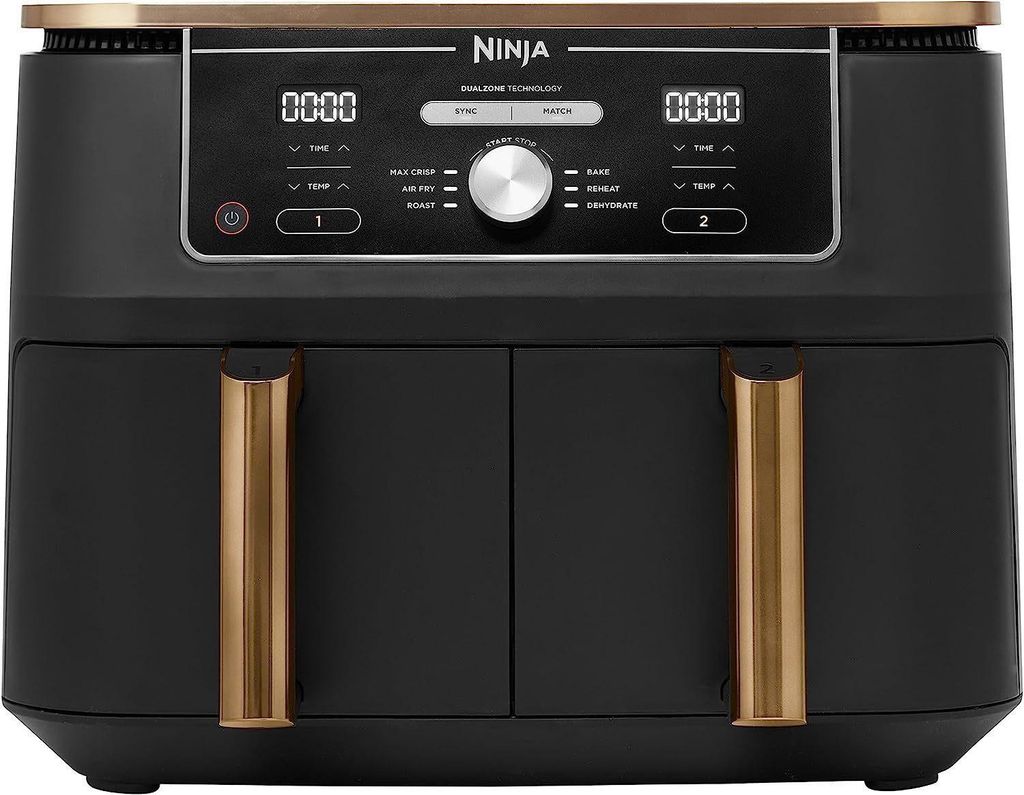 A front view of a black Ninja Foodi MAX DualZone air fryer with gold accents on the handles and top trim. The digital display and control panel are visible.