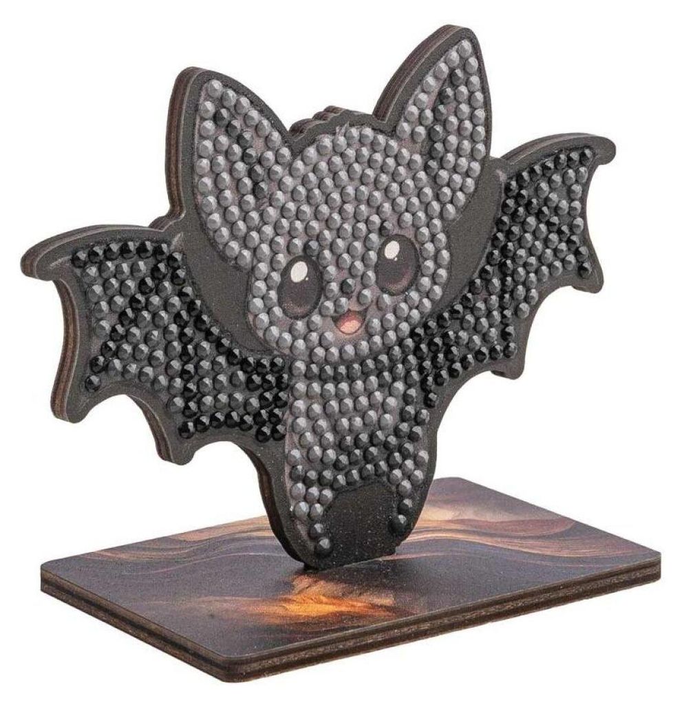A diamond painting craft kit of a bat on a stand.