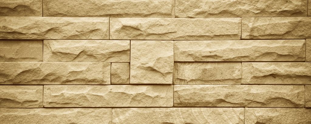 Wallario selbstklebendes Poster - Steinwand gelb, Größe: 50 x 125 cm