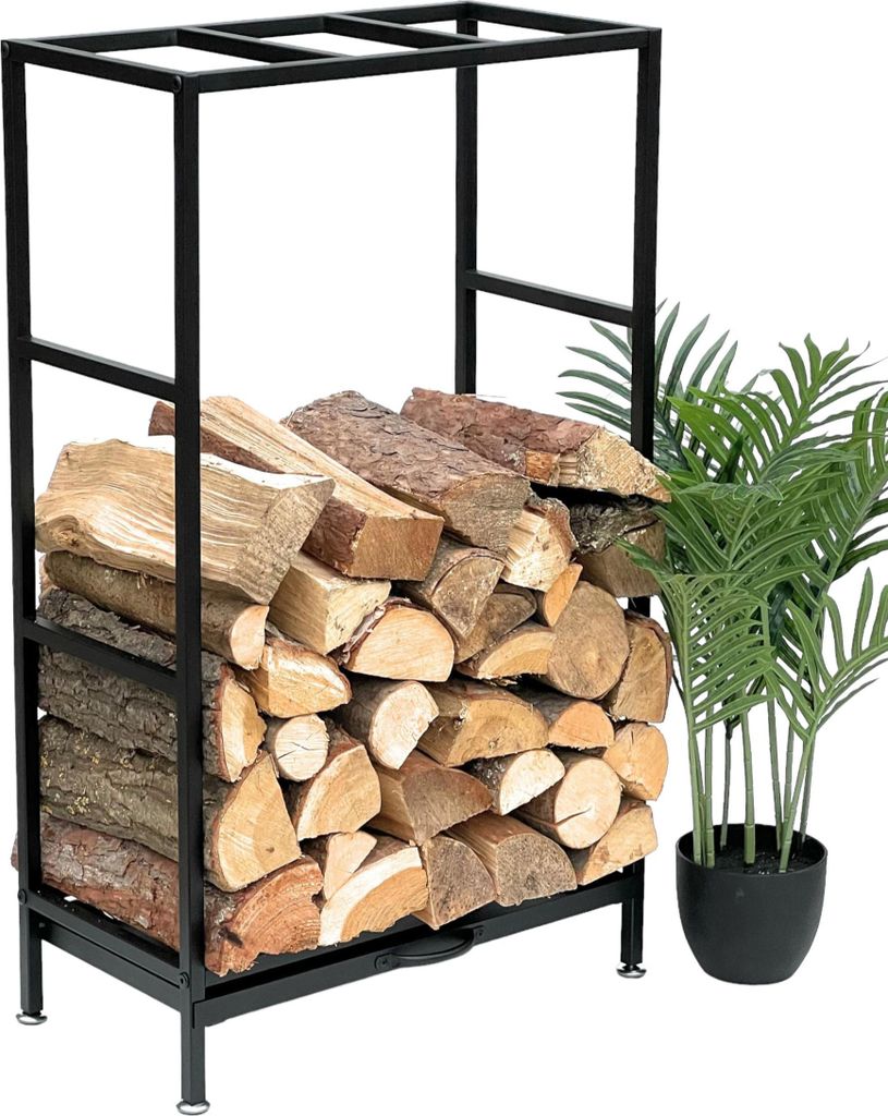 A black metal firewood rack filled with logs, next to a potted plant.