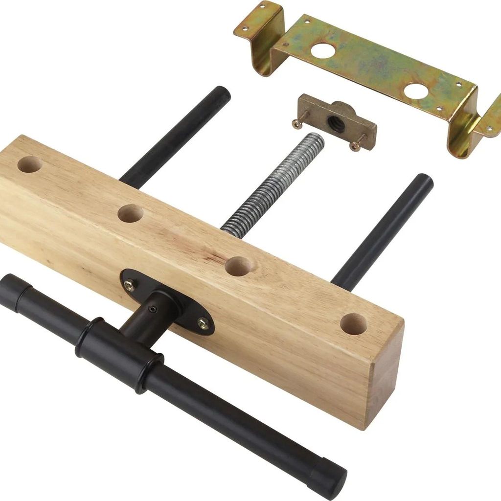 A woodworking vise and its components are laid out on a white background.