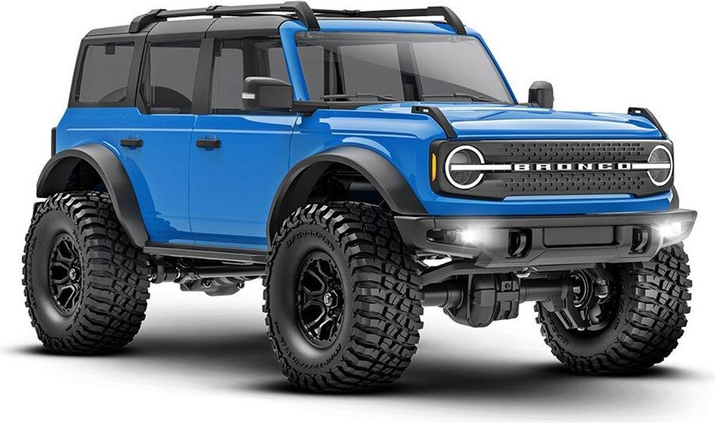 A blue Traxxas TRX-4M Ford Bronco 2021 1:18 RTR remote-controlled car is shown from a three-quarter front angle against a white background.