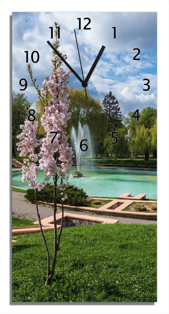 Wallario Design Wanduhr Frühling im Stadtpark aus Echtglas, Größe 30 x 60 cm