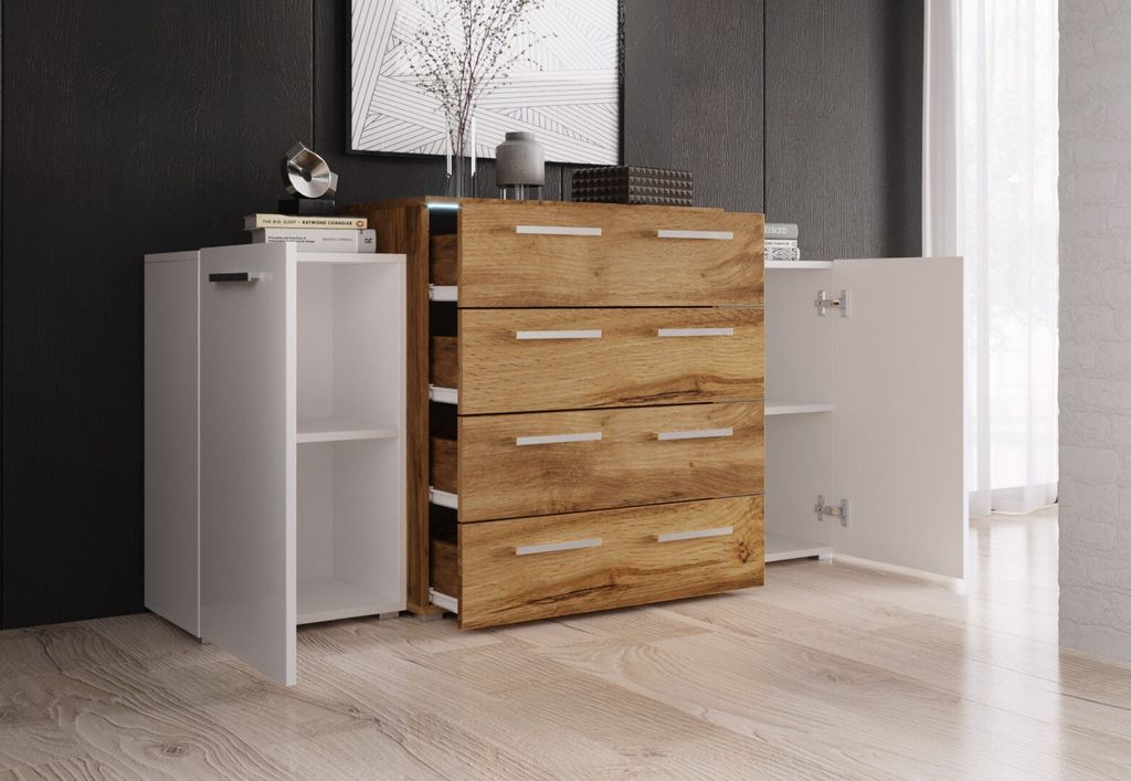 A modern dresser with white doors and a wood-grain drawer front, shown in a room setting with a dark wall and light wood floor.
