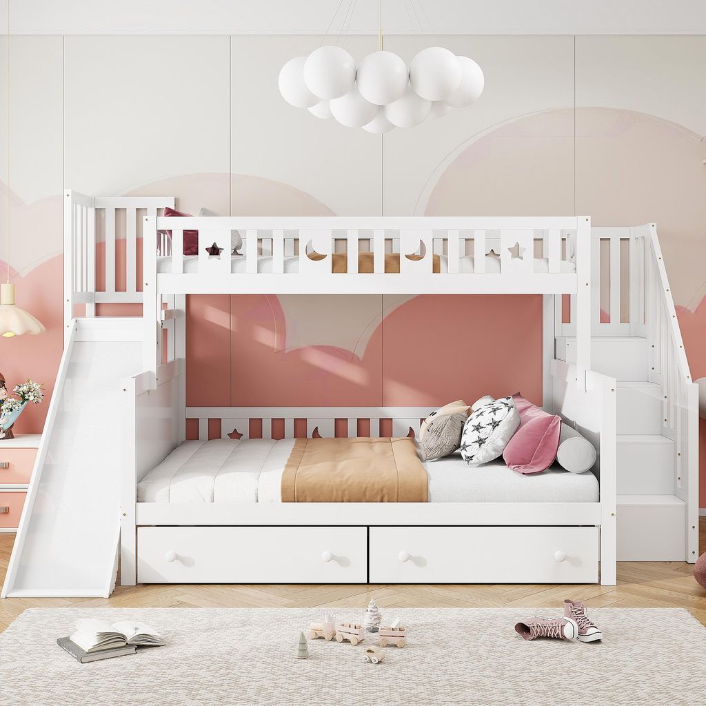 A white bunk bed with a slide and stairs, set in a child's bedroom with pink cloud-themed wallpaper.