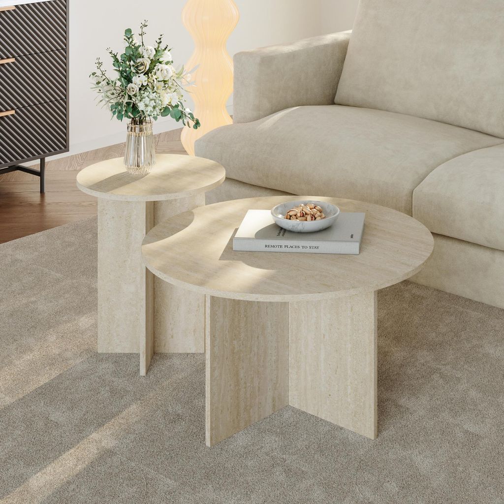 A living room scene with two round coffee tables, a sofa, and a cabinet.