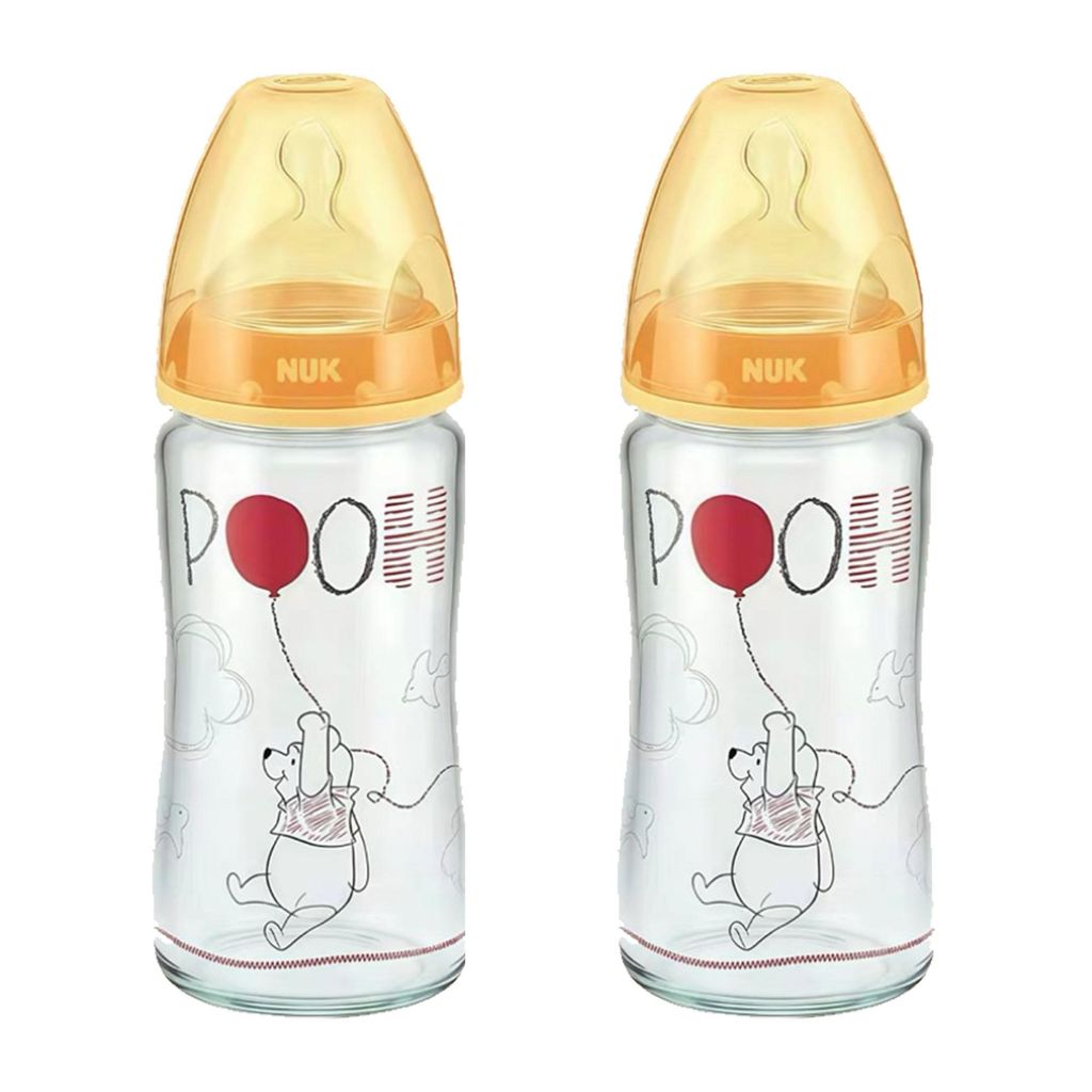 Two baby bottles with Winnie the Pooh design.
