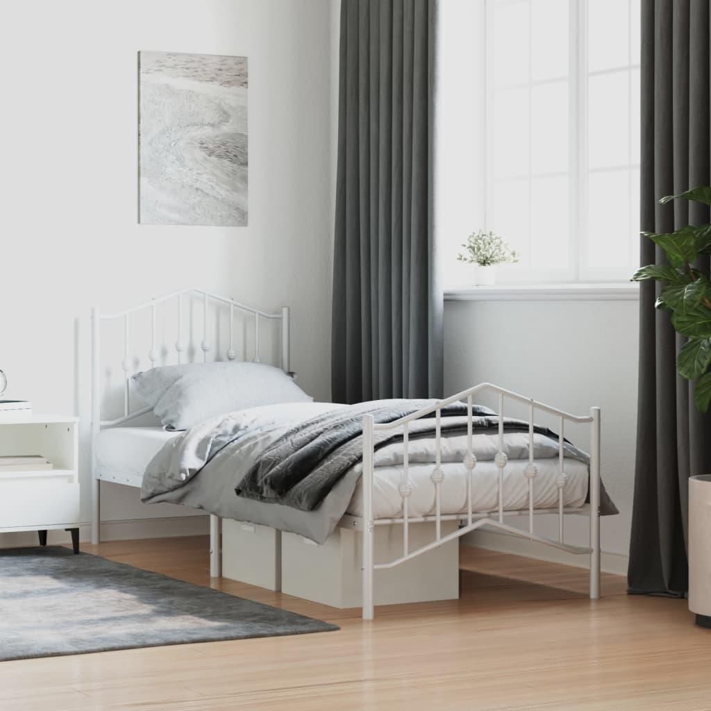 A white metal bed frame with bedding in a bedroom setting.
