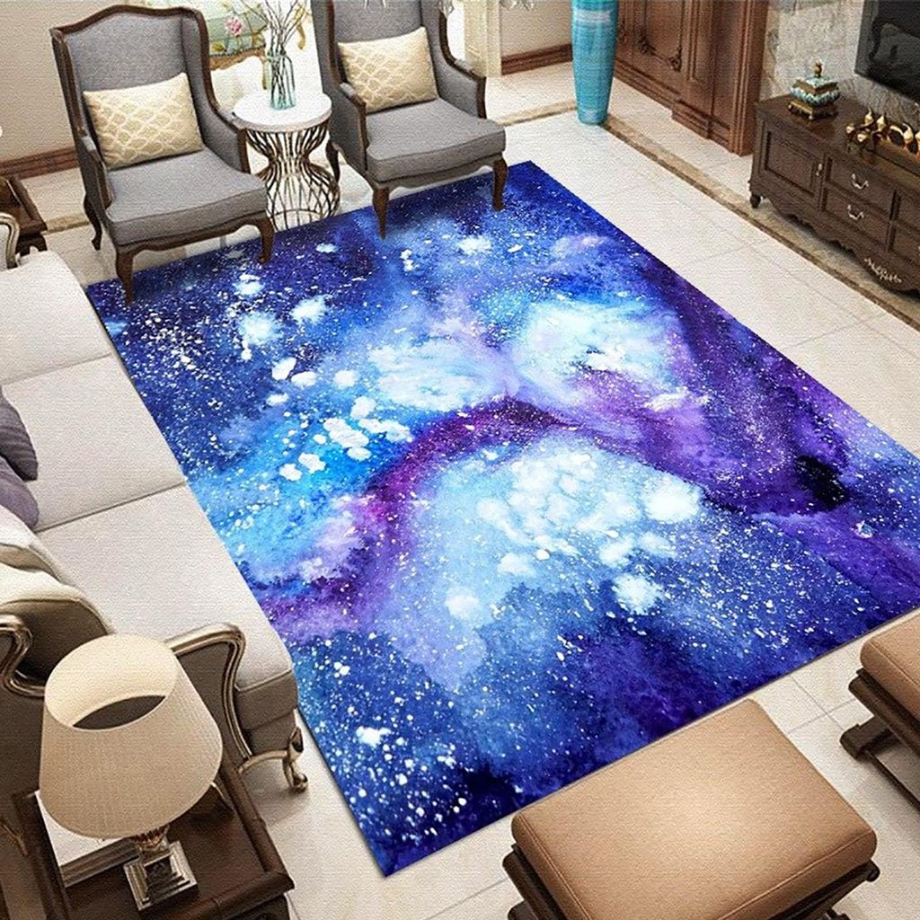 A living room scene with a galaxy-themed rug, chairs, and a sofa.