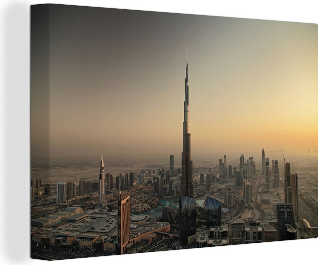 OneMillionCanvasses - Leinwandbilder - 150x100 cm, Sonnenuntergang hinter dem Burj Khalifa und Dubai, Wandbilder Kunstdruck Wanddekoration