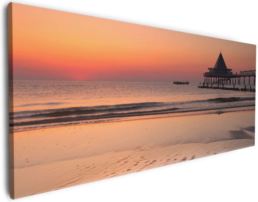 Wallario Premium Leinwandbild Strand am Abend - Seebrücke am Ostseebad Heringsdorf in Größe 50 x 125 cm