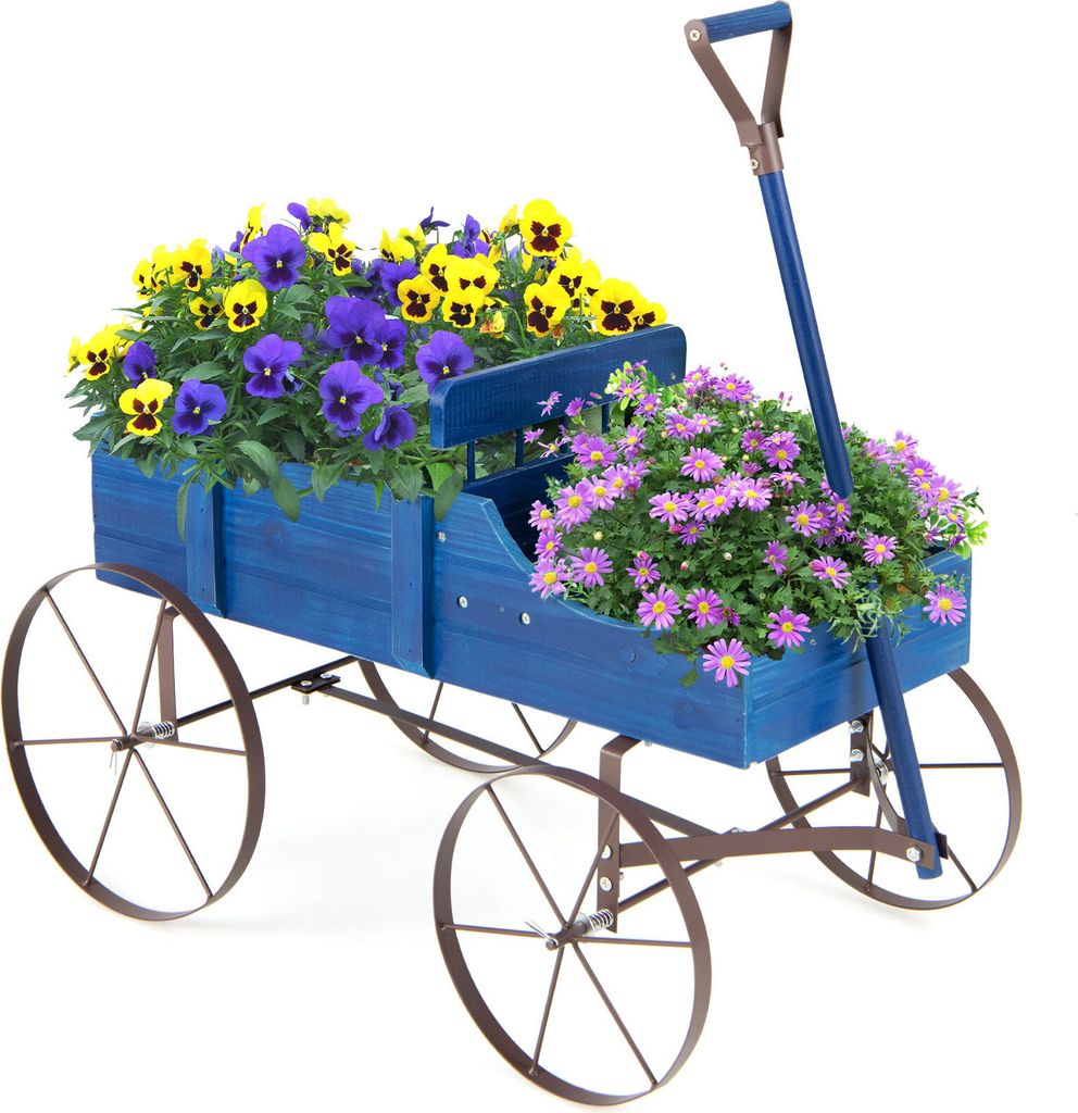 A blue wooden wagon filled with yellow and purple pansies and pink asters, set against a white background.