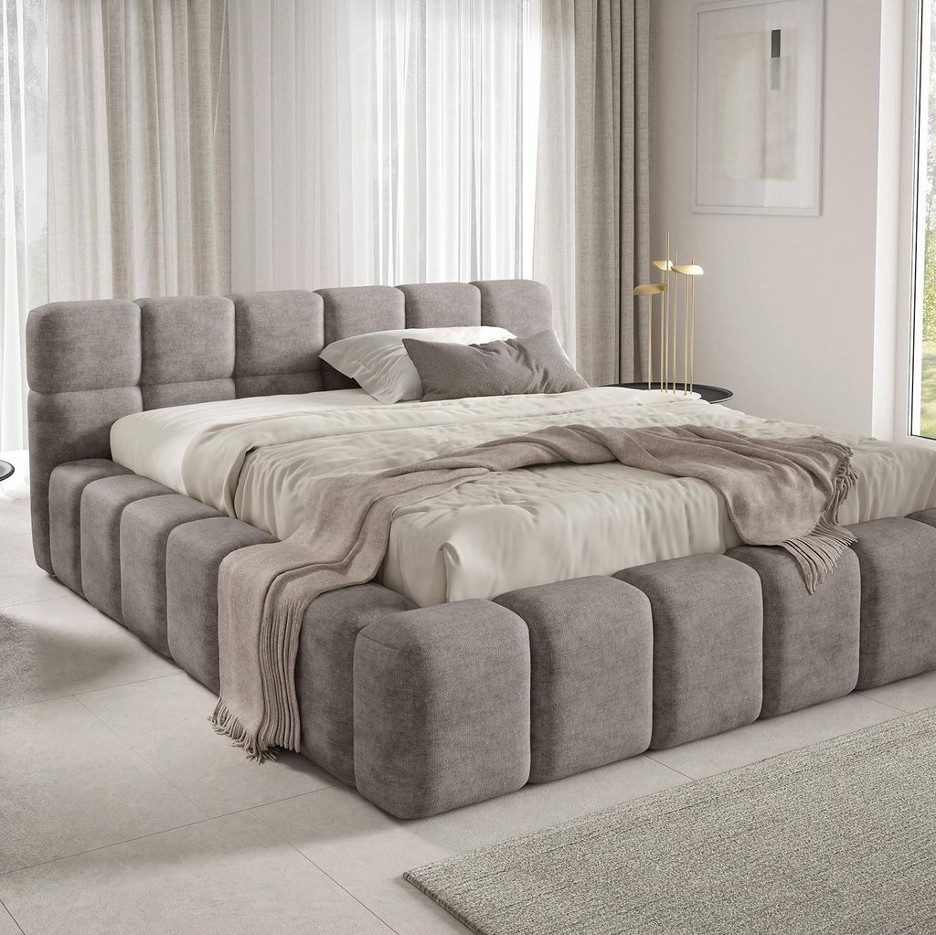 A modern upholstered bed in a bedroom setting.
