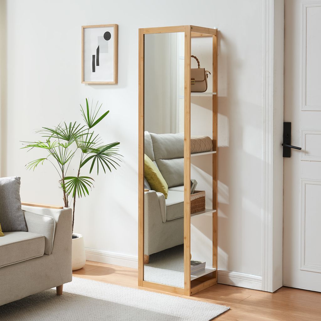 A tall, narrow shelf with a mirror on one side and open shelves on the other, placed in a living room setting.