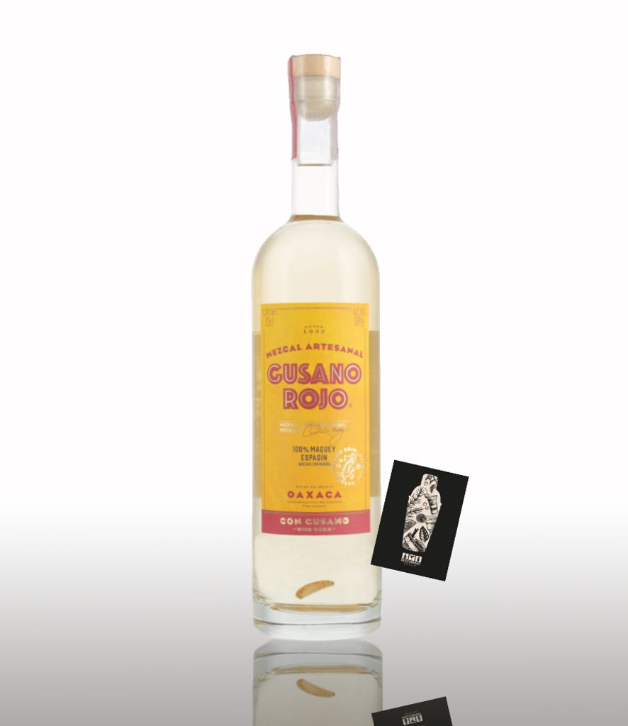 A bottle of Gusano Rojo Mezcal is shown against a white background with a reflection.
