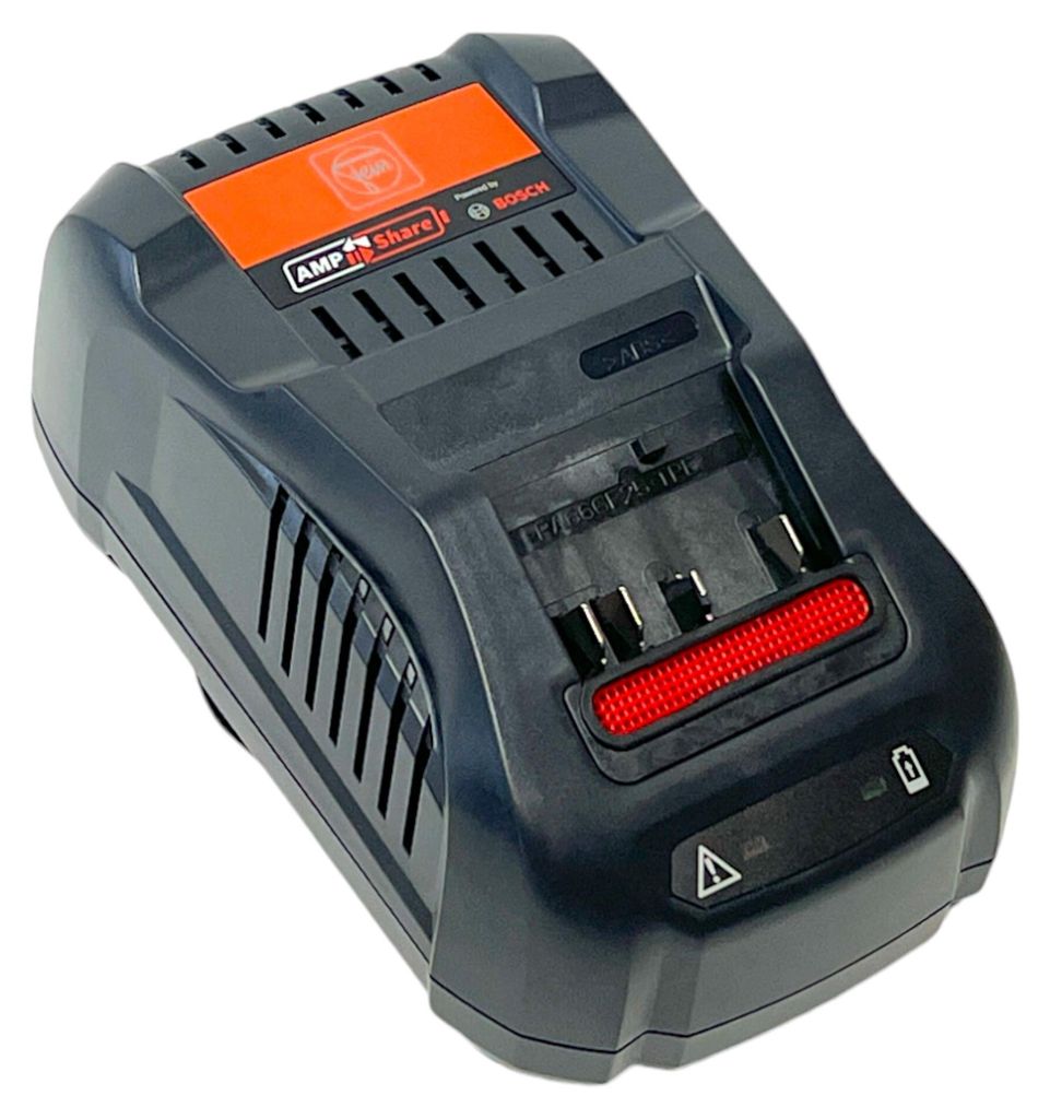 A black and gray battery charger with an orange accent is shown from a slightly elevated angle against a white background.