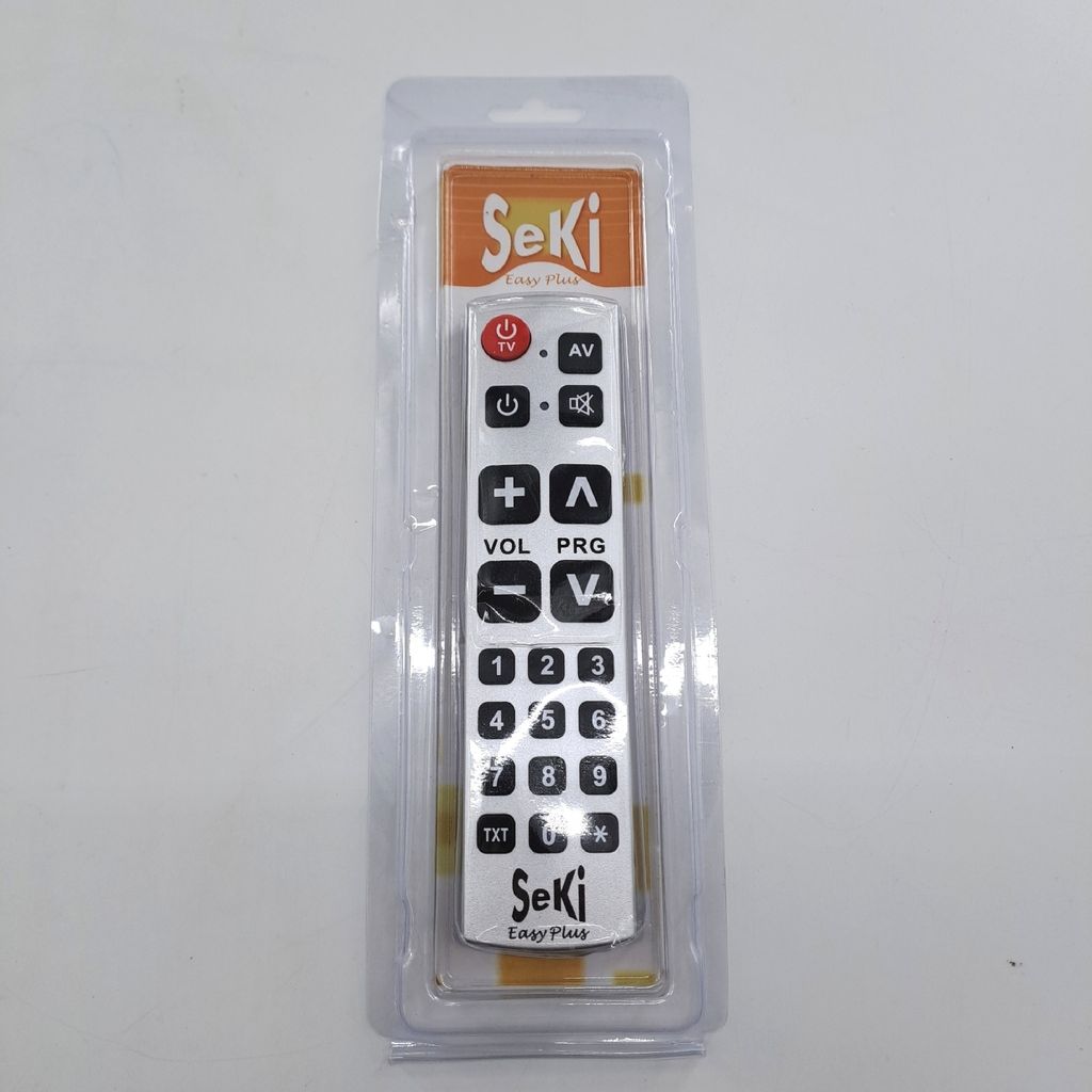 A remote control for a TV and radio is shown in its packaging.