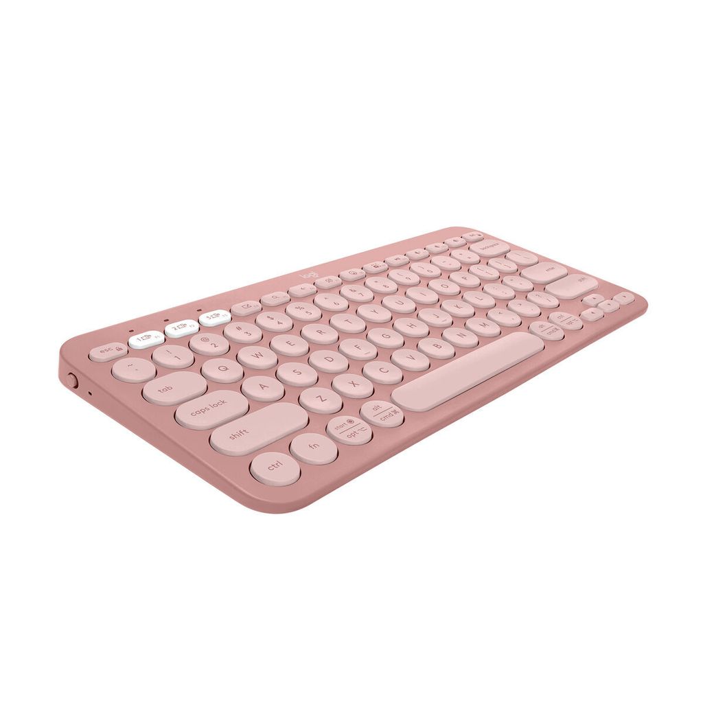 A pink Logitech Pebble Keys 2 K380s keyboard is shown from a slightly elevated side angle against a white background.