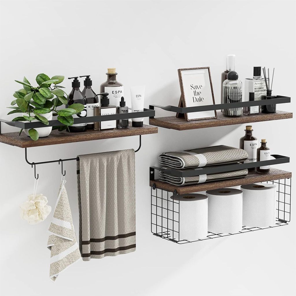 Two wooden shelves with black metal frames mounted on a white wall, displaying various bathroom accessories.