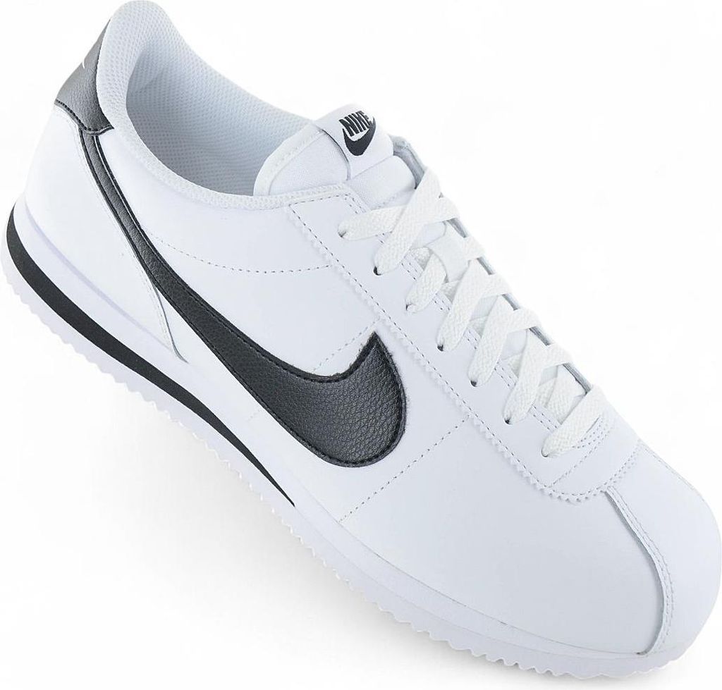 A white Nike Cortez sneaker with black accents is shown against a white background.
