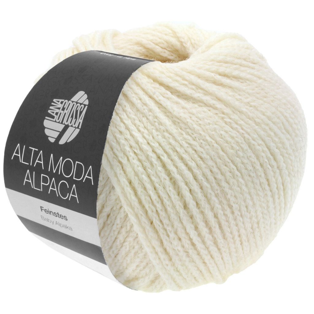A ball of cream-colored yarn with a black label.