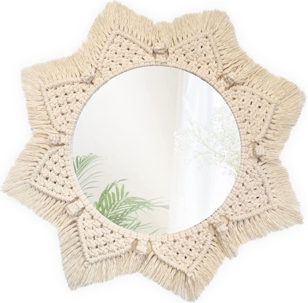 A macrame mirror with a starburst design.